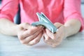 Trader woman counting dollars at table