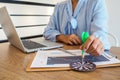 Trader woman holding a darts aiming at the target center of dart board, Setting challenging trading goals And ready to achieve