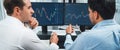 Traders discussing with two market stock screen on panorama view,. Sellable. Royalty Free Stock Photo