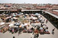 Traders selling goods under sun umbrellas