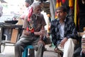 Traders of souvenirs waiting pilgrims and tourists in front of the Kalighat temple in Kolkata Royalty Free Stock Photo