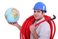 Tradesman holding a globe