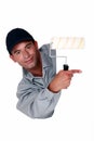 Tradesman holding a paint roller