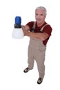 Tradesman holding a spray gun