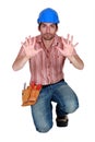 Tradesman holding up his hands Royalty Free Stock Photo