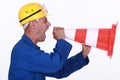 Tradesman screaming into a pylon Royalty Free Stock Photo