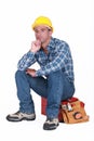 Tradesman sitting on toolchest