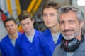Tradesman with three apprentices Royalty Free Stock Photo