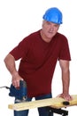 Tradesman using a jigsaw Royalty Free Stock Photo