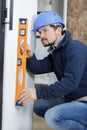 tradesman using spirit level Royalty Free Stock Photo