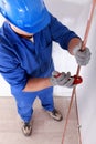 Tradesman using a tool Royalty Free Stock Photo