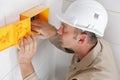 tradesman working in tiled room Royalty Free Stock Photo