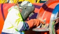 Tradesman working with welding torch