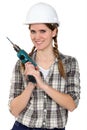 Tradeswoman holding a drill