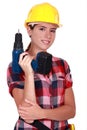 Tradeswoman holding a power tool
