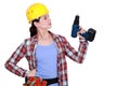 Tradeswoman holding an electric screwdriver