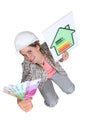 Tradeswoman holding up a wad of cash