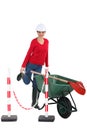 Tradeswoman pushing a wheelbarrow