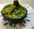 Guacamole in a stone molcajete Royalty Free Stock Photo