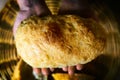 Tradiional Italian ciabatta bread on hands