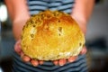 Tradiional Italian ciabatta bread on hands