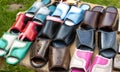 Trading in the market of shoes with flip flops made of genuine leather. Multicolour woven leather sandals, comfortable