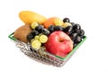 Ripe juicy fruits - apple, grapes, banana, kiwi, blueberries - lie in a trading metal basket. Royalty Free Stock Photo