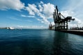 Trading seaport with cranes, cargoes and the ship Singapore Royalty Free Stock Photo