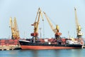 The trading seaport with cranes, cargoes and ship Royalty Free Stock Photo