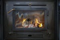 Tradional black Wood Burning Stove close-up with fire flames, antique design cozy Royalty Free Stock Photo