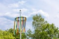 Tradiotional maypole with blue sky