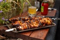 Traditioanal chicken shish kebab on skewers cookeg on open fire