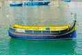 Traditioanl fishermen boat in Spinola bay at Malta Royalty Free Stock Photo