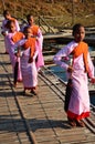 Tradition of almsgiving Burmese nuns women group procession walk on bridge for thai people respect praying put food offerings in