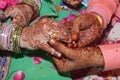 A tradition of engagement of Hindus of old customs in which the boy and the girl are wearing mehendi in the hands of girl wearing