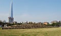 Tradition and modernity: Baekje grave sites in front of skyscraper, Seoul, Korea