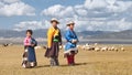 Traditiona dressed Tibetan children in a steppe, Qinghai Province, China