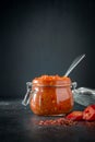 Traditional adjika hot chili pepper sauce paste harissa.Tunisia, georgian and arabic cuisine