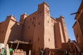 Traditional adobe kasbah in Morocco under blue sky. Royalty Free Stock Photo