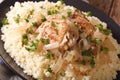 Traditional African food: poulet Yassa with onion and couscous m