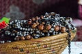 Traditional African jewelry stacked in straw basket at historical Fon`s palace, Bafut, Cameroon, Africa