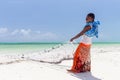 Traditional african local rural fishing on Paje beach, Zanzibar, Tanzania. Traditionally dressed local woman pulling