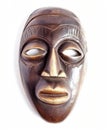 Traditional African mask with intricate colored details on a white background Royalty Free Stock Photo