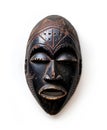 Traditional African mask with intricate colored details on a white background Royalty Free Stock Photo