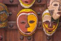 Traditional african masks. Painted wooden masks. Art market in Stone Town. Tourism in Zanzibar. African culture.