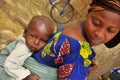 Traditional african women with baby on the back Royalty Free Stock Photo