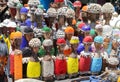Traditional African wooden handmade dolls with seashells and colorful bead decoration at local craft market, Cape Town, South Afri