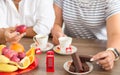 Traditional afternoon tea of british ceremony with such symbol of britishness as toy telephone box