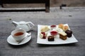 Traditional afternoon tea set on wooden table