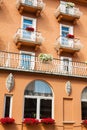 Traditional alpine houses with flowers on balcony, Cortina d'Amp Royalty Free Stock Photo